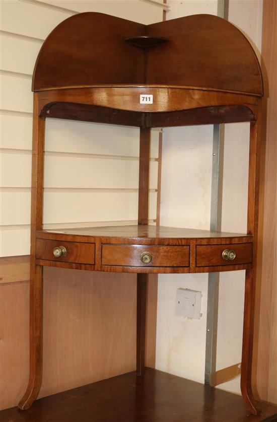 A Regency mahogany bowfront corner washstand, H.110cm